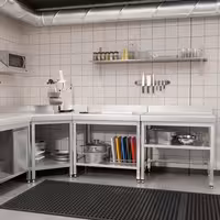 Rozsdamentes acél munkaasztal PREMIUM - 700x600 mm - alsó polccal & hátsó peremmel